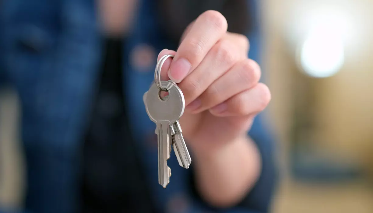Picture of a hand holding keys.
