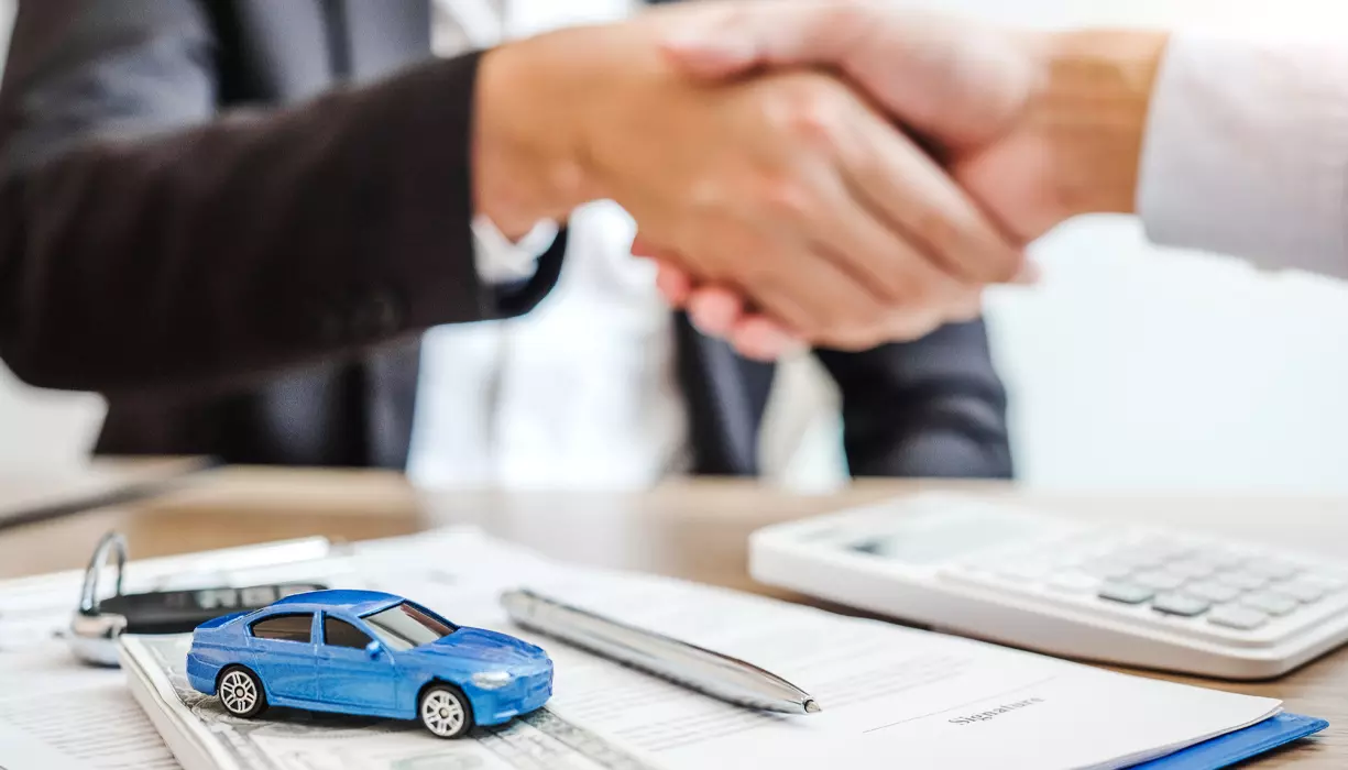 A closeup image of two people shaking hands.
