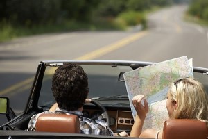 Couple on road trip with a map